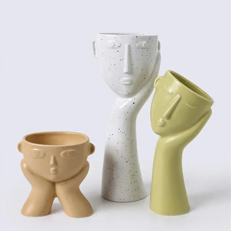 Contemporary Ceramic Vase Featuring Abstract Human Face Design