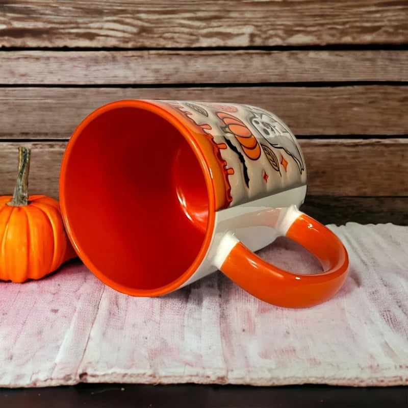 Coffee Mug Featuring Ghost Design and Pumpkin Motif