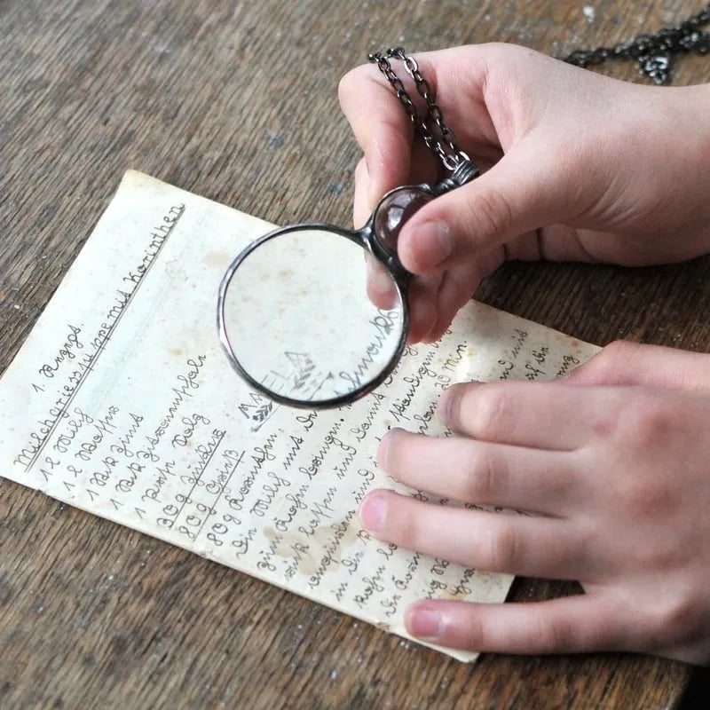 Necklace Featuring a Magnifying Pendant