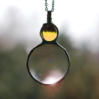 Necklace Featuring a Magnifying Pendant