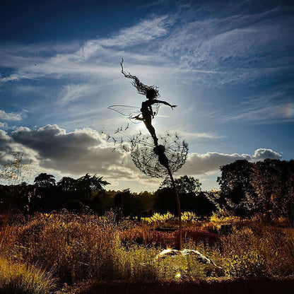 Outdoor Garden Sculpture of Fairies and Dandelions Dancing Together