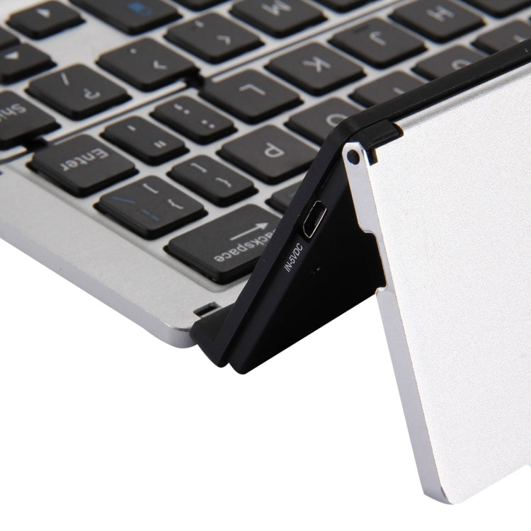Ultra-slim 58-Key Bluetooth Wireless Keyboard with Holder – Rechargeable, Foldable (Silver)