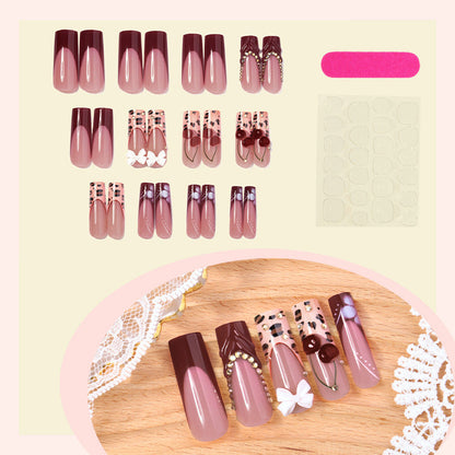 Decorative Press-On Nail Set with Artistic Design Elements