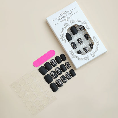 Elegant Design Press-On Nail Set with Artistic Elements