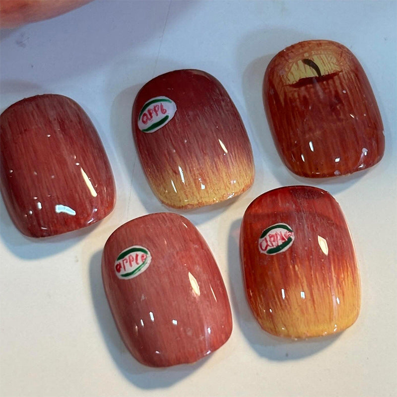 Press-On Nail Kit Featuring Creative Apple Patterns