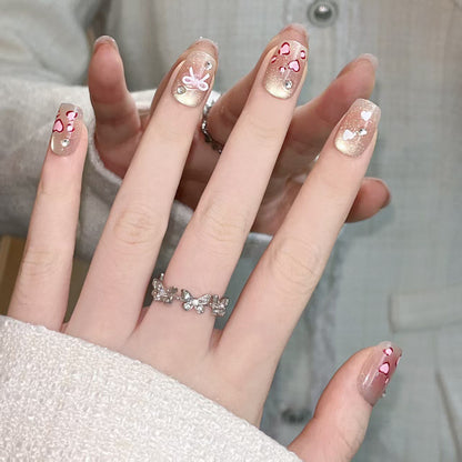 Press-On Nail Art Set Featuring Heart and Bow Patterns