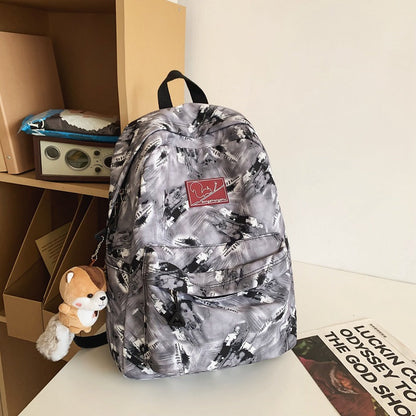 Versatile School Backpack with Abstract Pattern Design