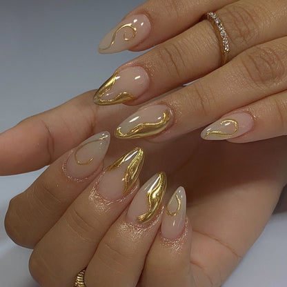 Elegant Nail Design with Stiletto Shape and Gold Details