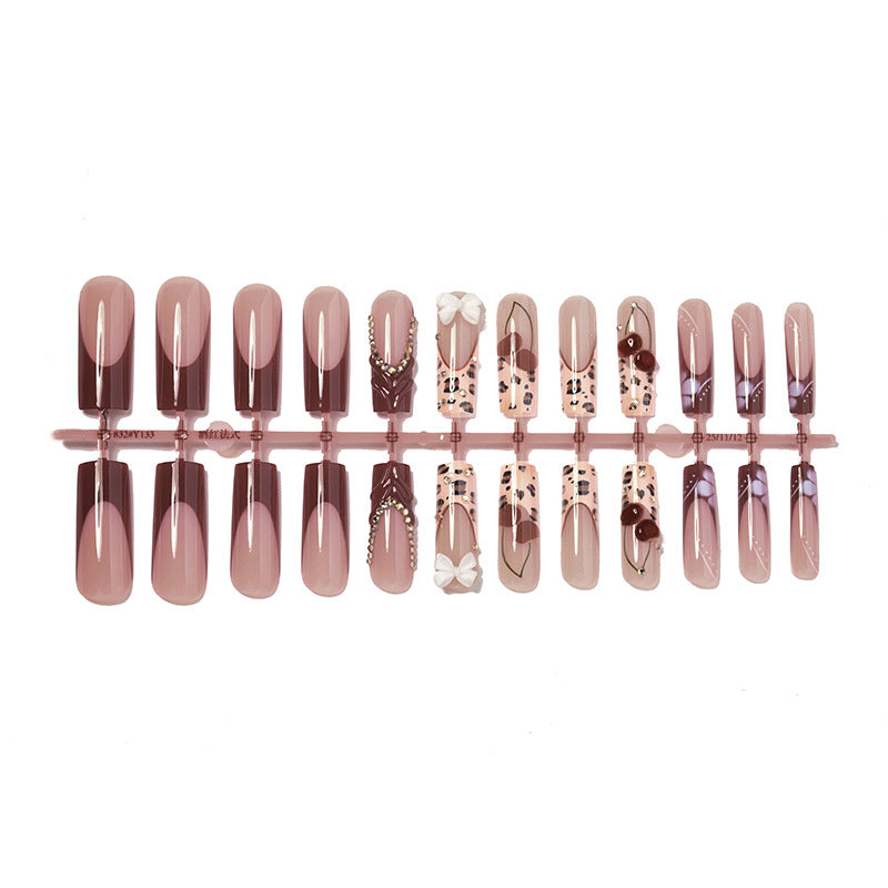 Decorative Press-On Nail Set with Artistic Design Elements
