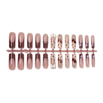 Decorative Press-On Nail Set with Artistic Design Elements