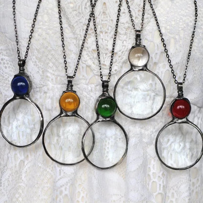 Necklace Featuring a Magnifying Pendant