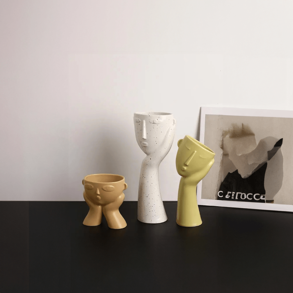 Contemporary Ceramic Vase Featuring Abstract Human Face Design
