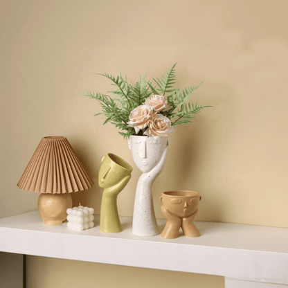 Contemporary Ceramic Vase Featuring Abstract Human Face Design