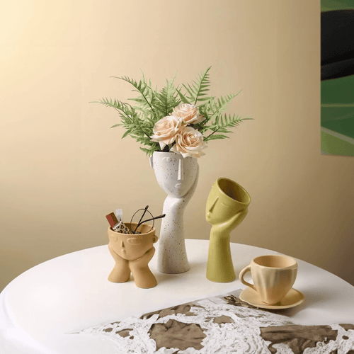 Contemporary Ceramic Vase Featuring Abstract Human Face Design