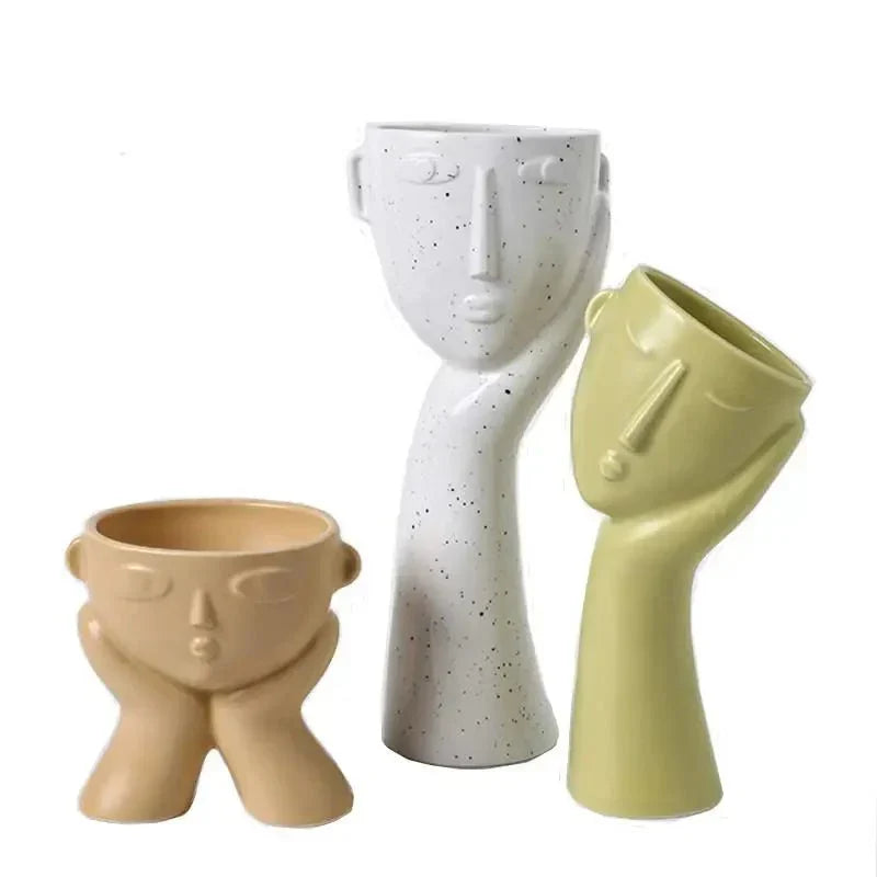 Contemporary Ceramic Vase Featuring Abstract Human Face Design