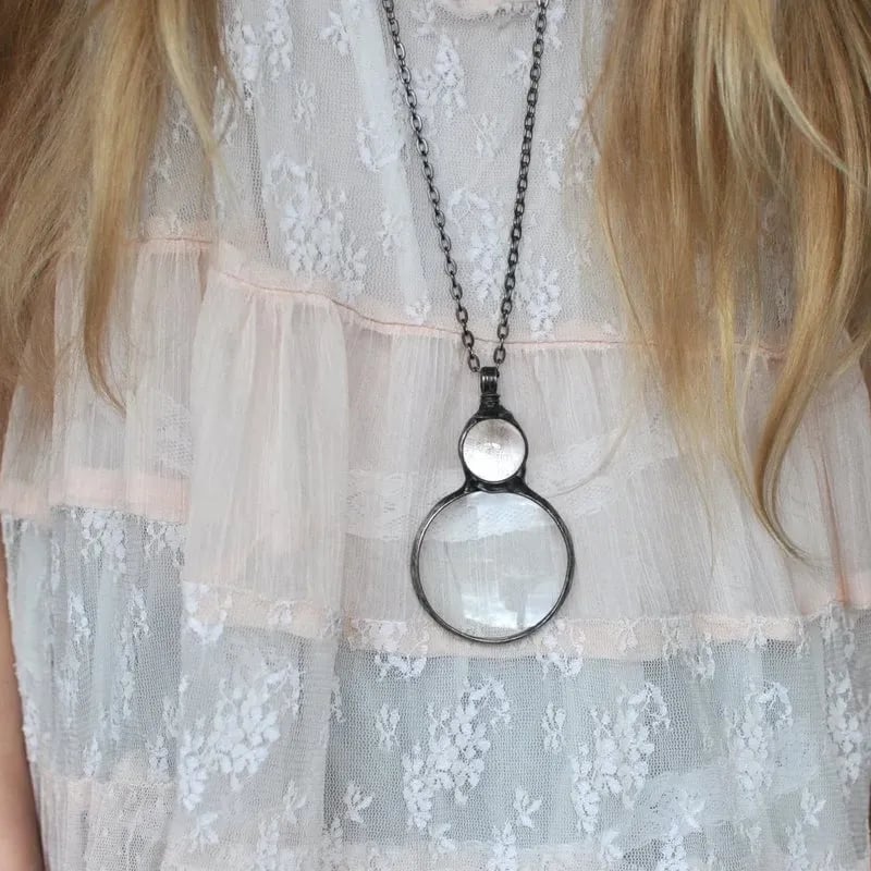Necklace Featuring a Magnifying Pendant