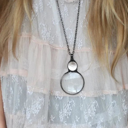 Necklace Featuring a Magnifying Pendant