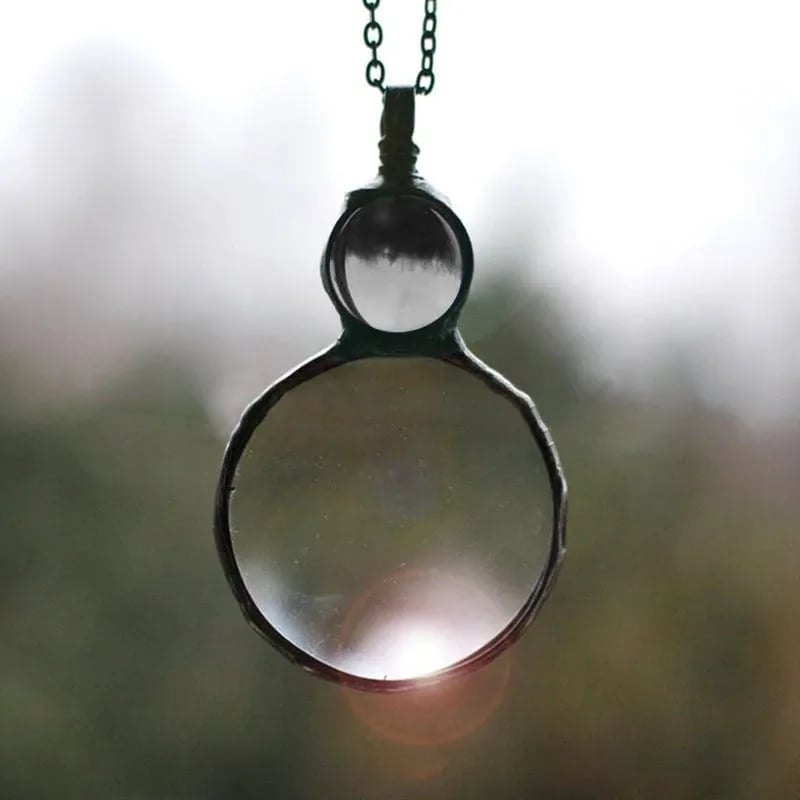 Necklace Featuring a Magnifying Pendant