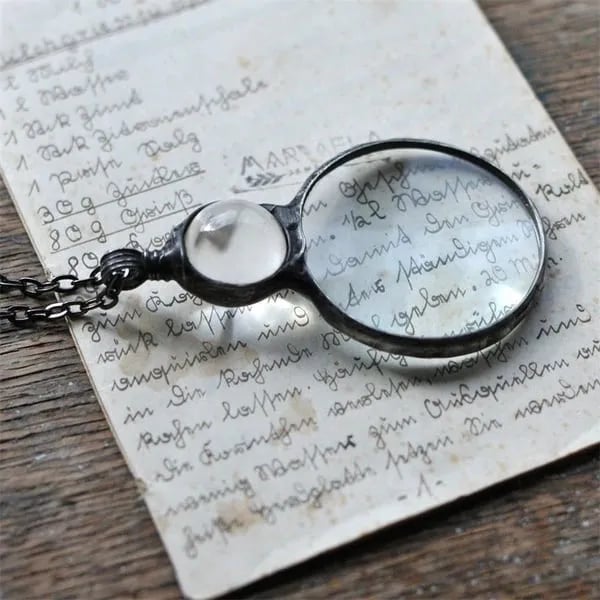 Necklace Featuring a Magnifying Pendant