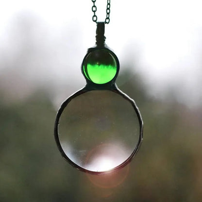 Necklace Featuring a Magnifying Pendant